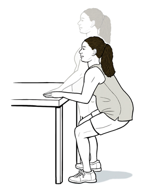 Woman holding on to side of table doing mini squats.