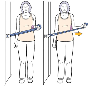 Woman standing by door with exercise band looped around doorknob doing external rotation shoulder exercise.