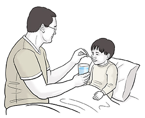 Man giving sick child in bed water by spoonfuls.